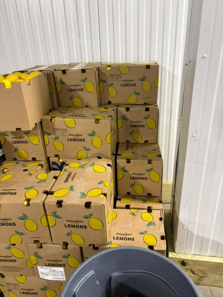 Fresh lemons stacked and ready in the warehouse